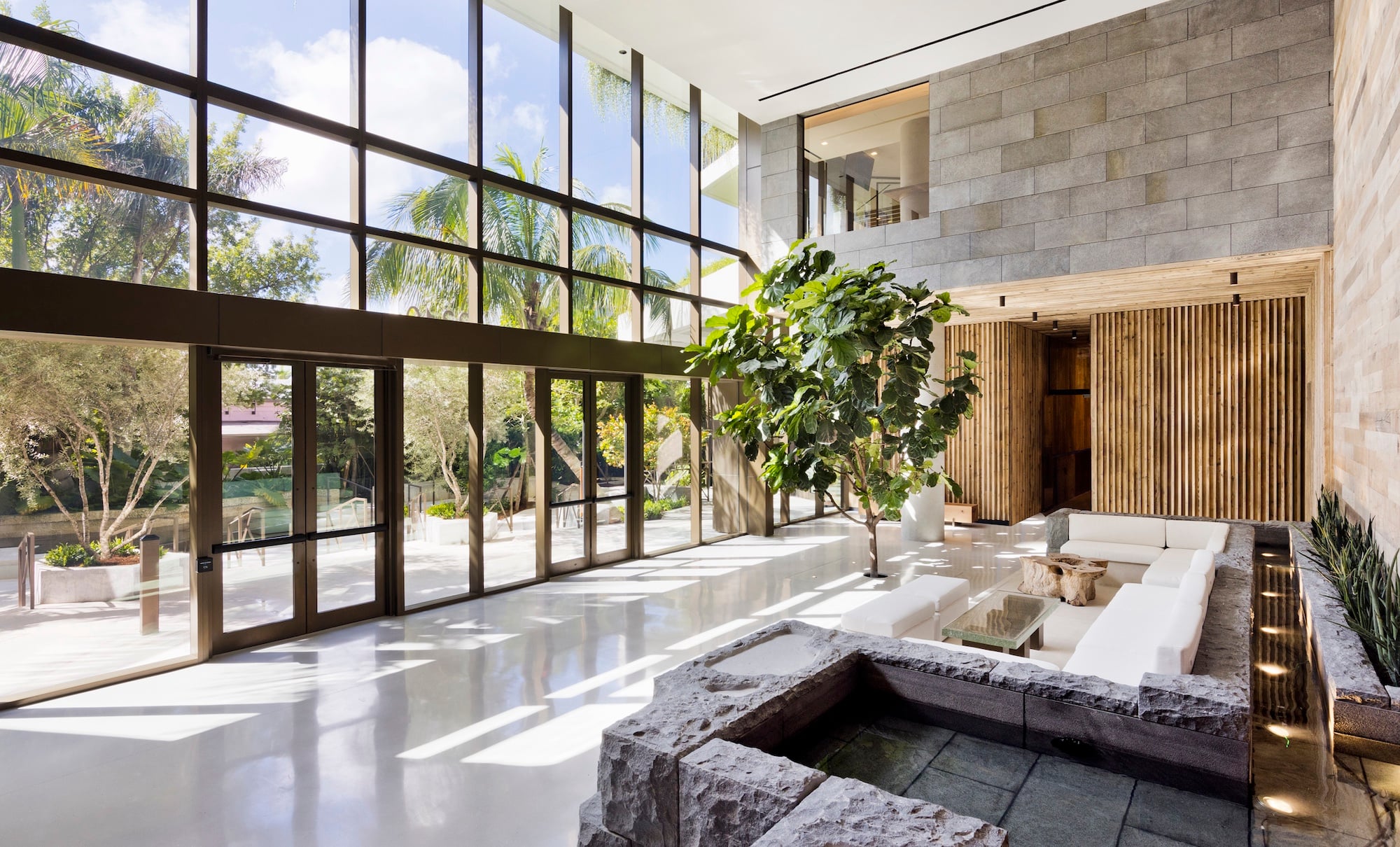 Unique and modern design of lobby with large windows and doors in a tropical city