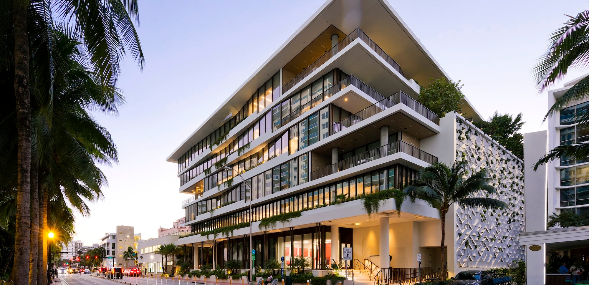 Starwood Capital Headquarter, a modern white building along with palm trees in Miami Beach