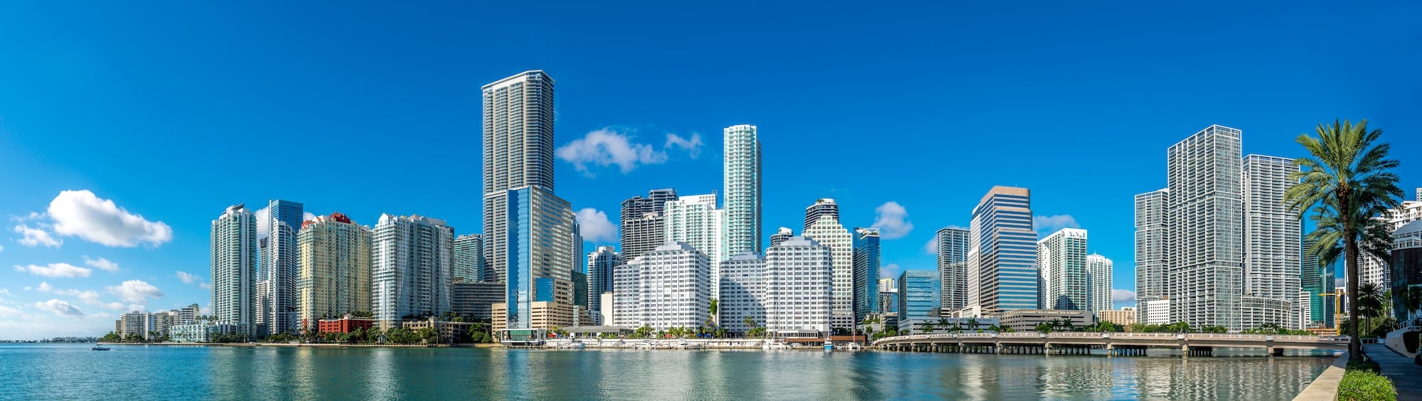 Several tall buildings with ocean - Highrise buildings in Brickell, Miami under clear